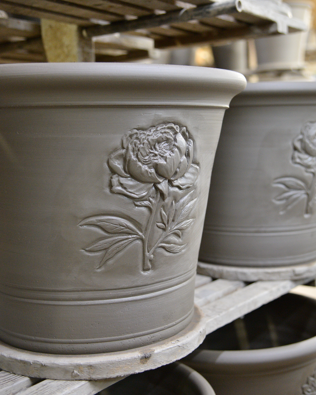 peony pots drying on a rack