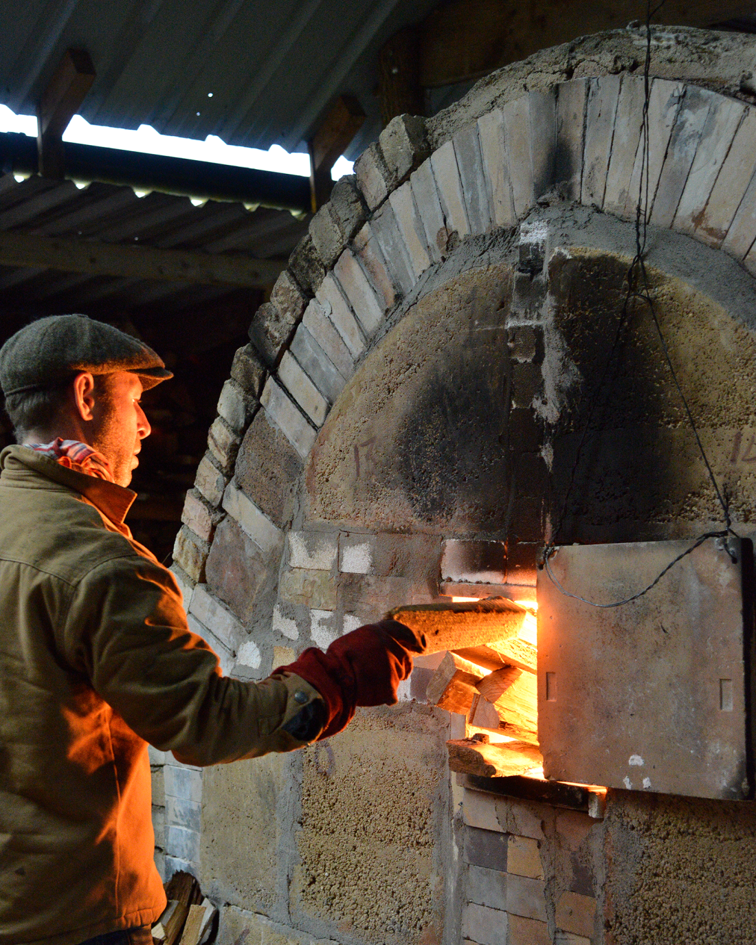 Adam Stoking Woodfired Kiln Whichford 